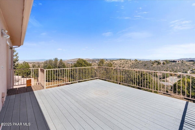 wooden terrace featuring a mountain view