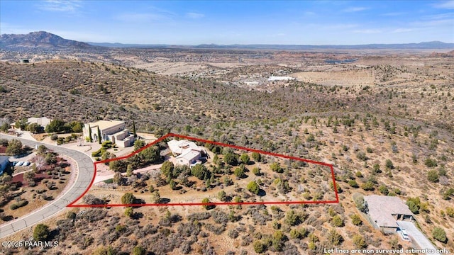 bird's eye view with a mountain view and view of desert