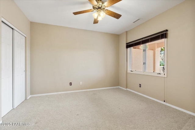 unfurnished bedroom with a closet, baseboards, visible vents, and carpet flooring