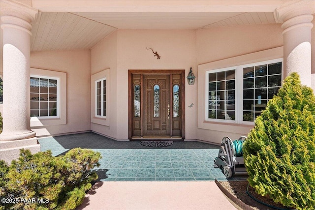 doorway to property with stucco siding