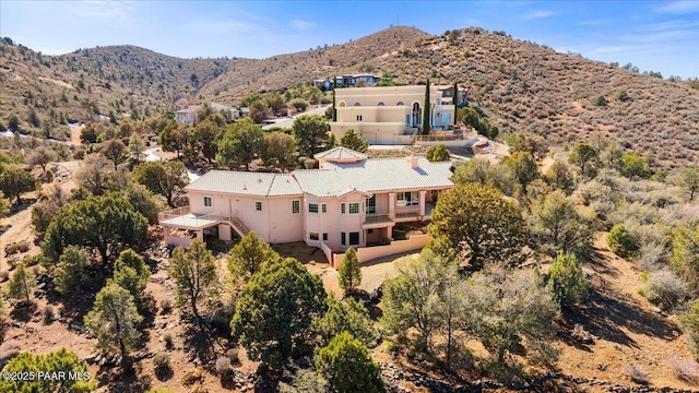 birds eye view of property with a mountain view