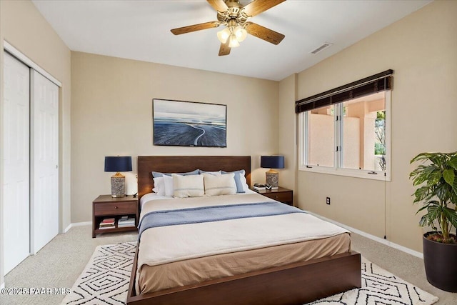 bedroom featuring a closet, visible vents, baseboards, and carpet floors