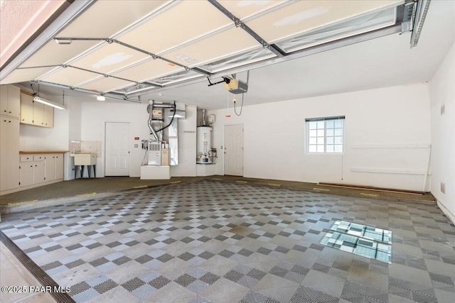 garage featuring heating unit, a garage door opener, and water heater