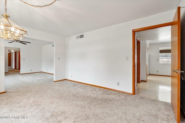 185 W Hereford Dr, Camp Verde, AZ 86322 - spare room with light carpet, baseboards, and ceiling fan