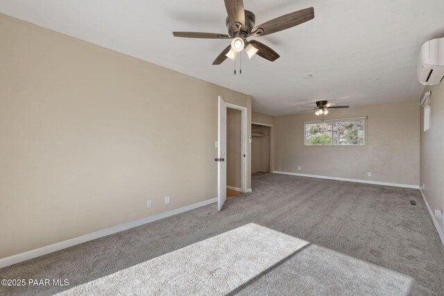 2615 W Red Tail Way, Prescott, AZ 86305 - spare room featuring an AC wall unit, ceiling fan, carpet, and baseboards
