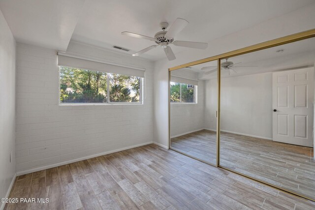 2615 W Red Tail Way, Prescott, AZ 86305 - unfurnished bedroom featuring wood finished floors, baseboards, a closet, and a ceiling fan