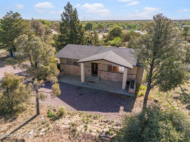 2615 W Red Tail Way, Prescott, AZ 86305 - rear view of house with stone siding, a patio area, and roof with shingles