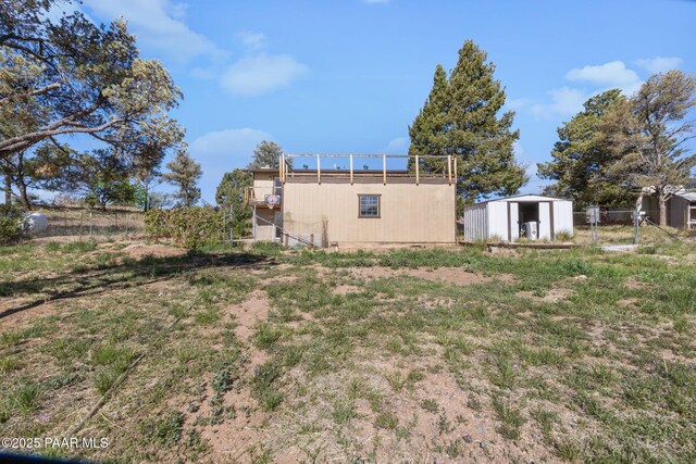 2615 W Red Tail Way, Prescott, AZ 86305 - back of house with an outbuilding, a storage shed, and fence