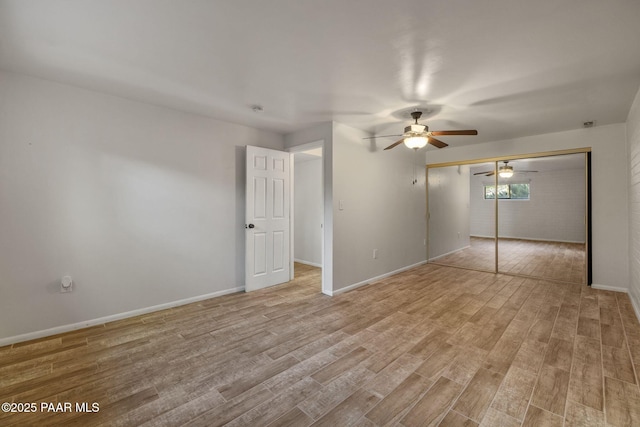 2615 W Red Tail Way, Prescott, AZ 86305 - unfurnished bedroom featuring light wood-style floors, a closet, baseboards, and ceiling fan