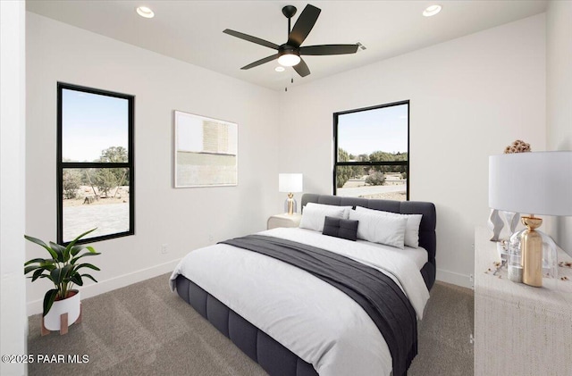 bedroom with carpet floors, recessed lighting, and multiple windows