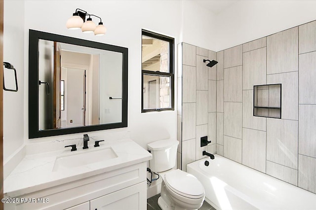 bathroom featuring shower / bathing tub combination, vanity, and toilet