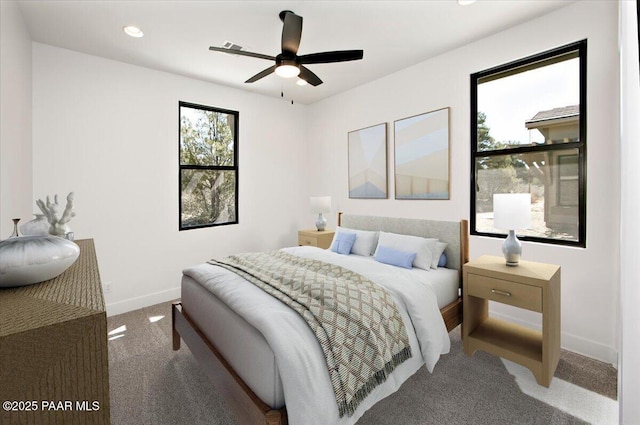 carpeted bedroom featuring recessed lighting and baseboards