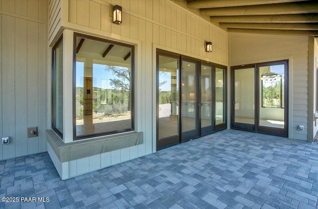 doorway to property featuring a patio area