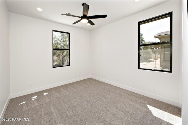 unfurnished room featuring recessed lighting, carpet floors, a ceiling fan, and baseboards