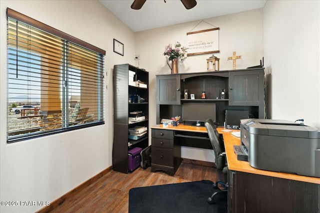 office space with baseboards, wood finished floors, and ceiling fan