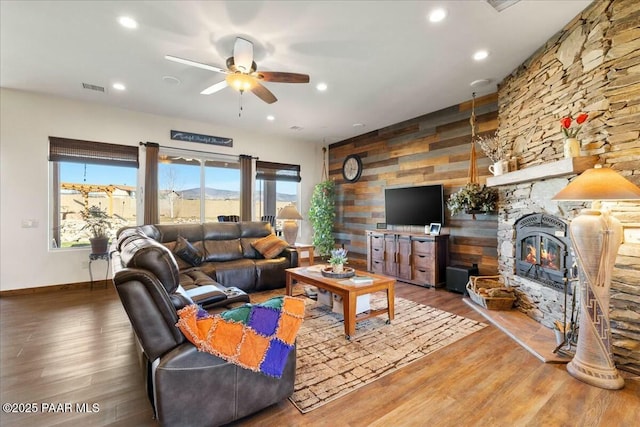 living room featuring visible vents, recessed lighting, a ceiling fan, and wood finished floors