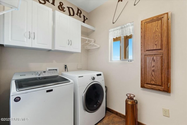 laundry area with cabinet space, baseboards, and washing machine and clothes dryer