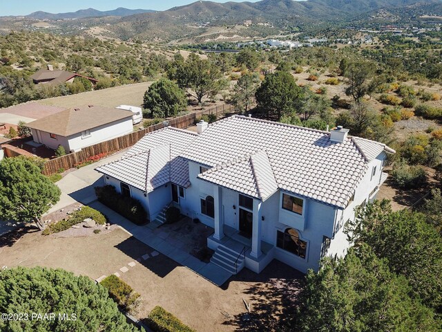 birds eye view of property with a mountain view