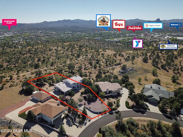 birds eye view of property with a mountain view