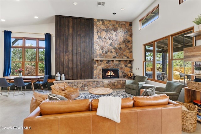 living room featuring recessed lighting, visible vents, finished concrete floors, and a healthy amount of sunlight
