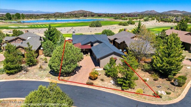 aerial view with a residential view, view of golf course, and a water and mountain view