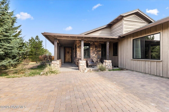 view of front of house featuring board and batten siding and covered porch