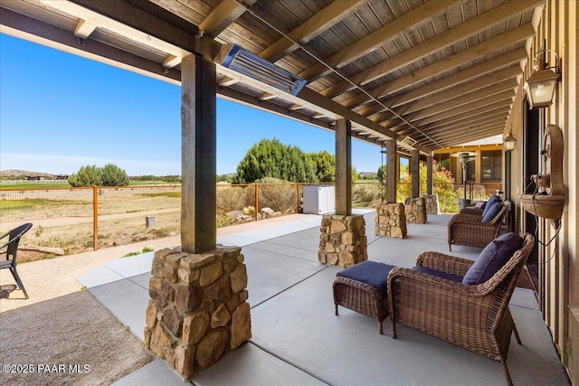 view of patio / terrace featuring fence