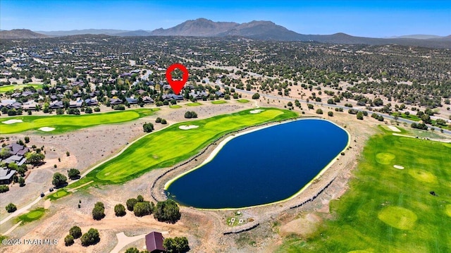 birds eye view of property with a residential view, a water and mountain view, and view of golf course