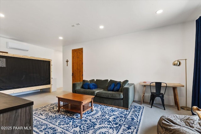 living area featuring an AC wall unit and recessed lighting