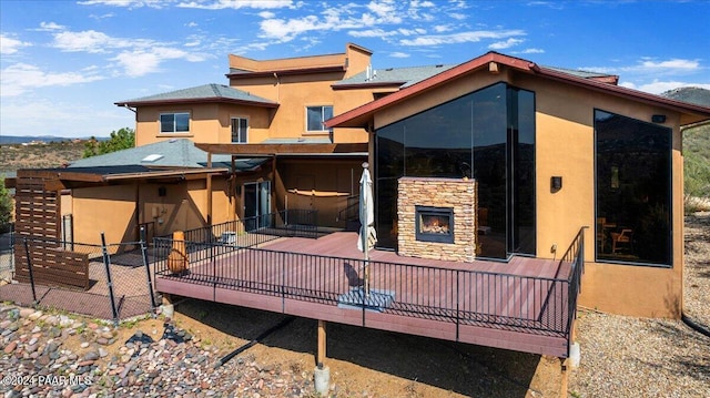 414 N Fitzmaurice Dr, Prescott, AZ 86303 - back of property with stucco siding, stone siding, and a deck