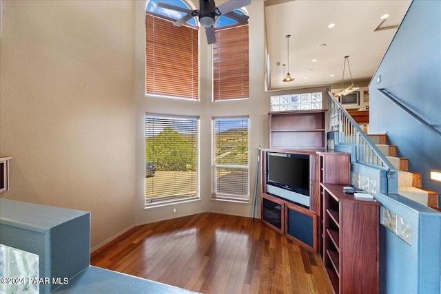 414 N Fitzmaurice Dr, Prescott, AZ 86303 - living area with baseboards, a towering ceiling, stairway, a ceiling fan, and hardwood / wood-style floors