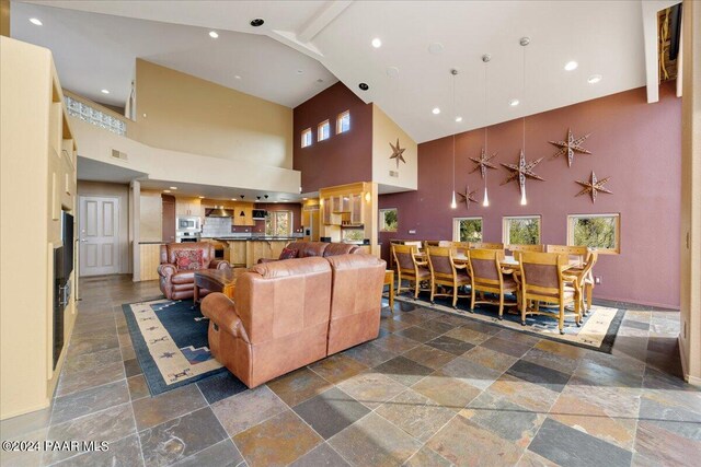 414 N Fitzmaurice Dr, Prescott, AZ 86303 - living room with a high ceiling, stone tile flooring, recessed lighting, and visible vents