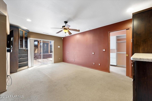 414 N Fitzmaurice Dr, Prescott, AZ 86303 - unfurnished living room with baseboards, visible vents, a ceiling fan, and light colored carpet