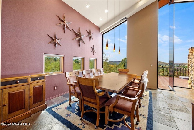 414 N Fitzmaurice Dr, Prescott, AZ 86303 - dining area with plenty of natural light, recessed lighting, a towering ceiling, and stone tile flooring