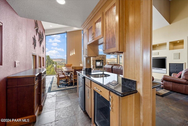 414 N Fitzmaurice Dr, Prescott, AZ 86303 - kitchen with recessed lighting, stainless steel dishwasher, a sink, beverage cooler, and stone tile flooring