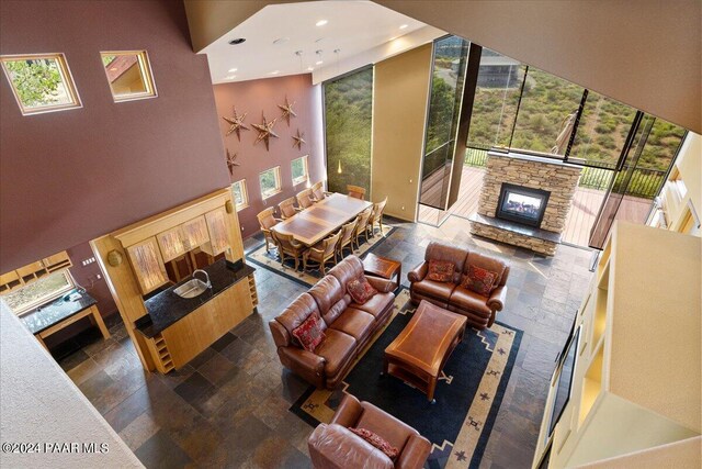 414 N Fitzmaurice Dr, Prescott, AZ 86303 - living room featuring a towering ceiling, stone finish floor, recessed lighting, and a stone fireplace
