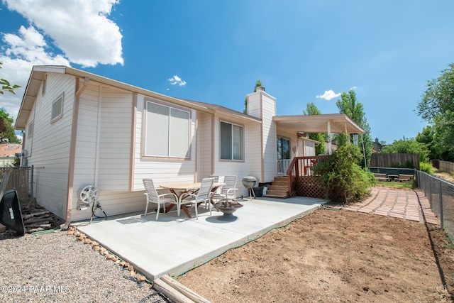 back of property featuring a patio