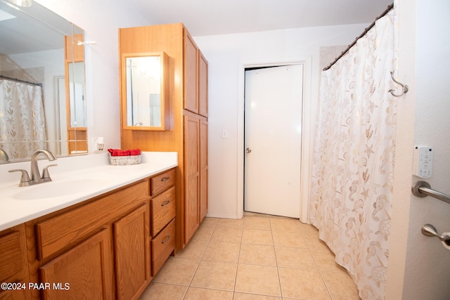 bathroom featuring tile patterned flooring and vanity