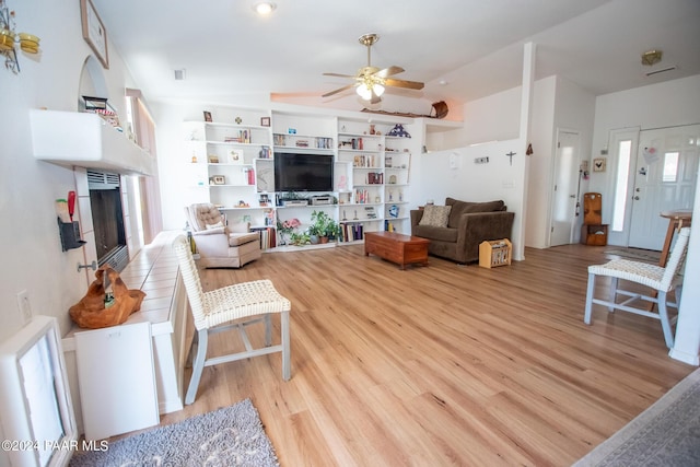 living room featuring ceiling fan and light hardwood / wood-style floors