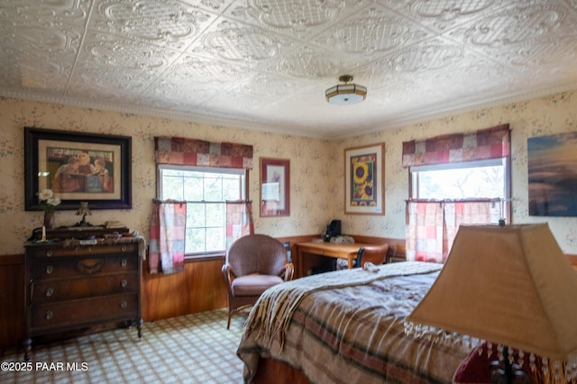 55409 Madre Cir, Seligman, AZ 86337 - bedroom featuring multiple windows, a wainscoted wall, and wood walls