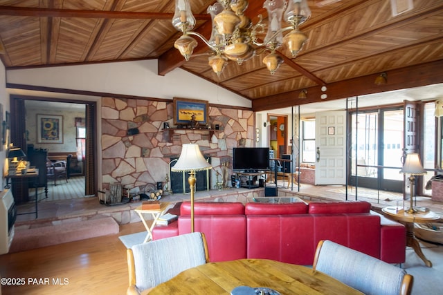 55409 Madre Cir, Seligman, AZ 86337 - living room featuring wood ceiling, a chandelier, wood finished floors, and a stone fireplace