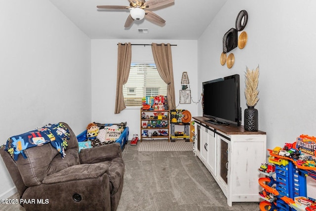 recreation room with ceiling fan and carpet flooring