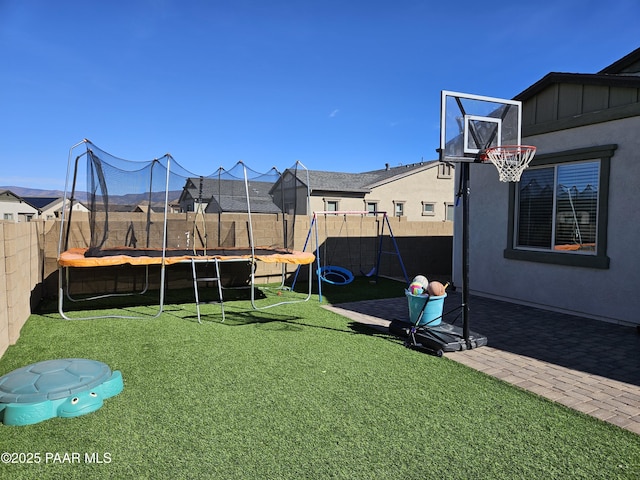 view of yard featuring a trampoline