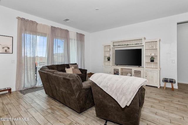 living room with light hardwood / wood-style floors