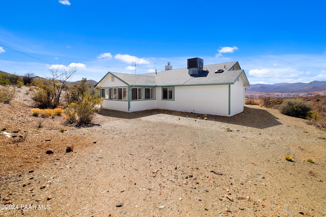 15015 E White Dr, Dewey-Humboldt, AZ 86327 - rear view of house with cooling unit and roof with shingles