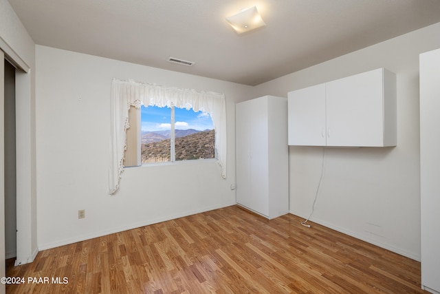 15015 E White Dr, Dewey-Humboldt, AZ 86327 - unfurnished bedroom with light wood-style floors and a closet