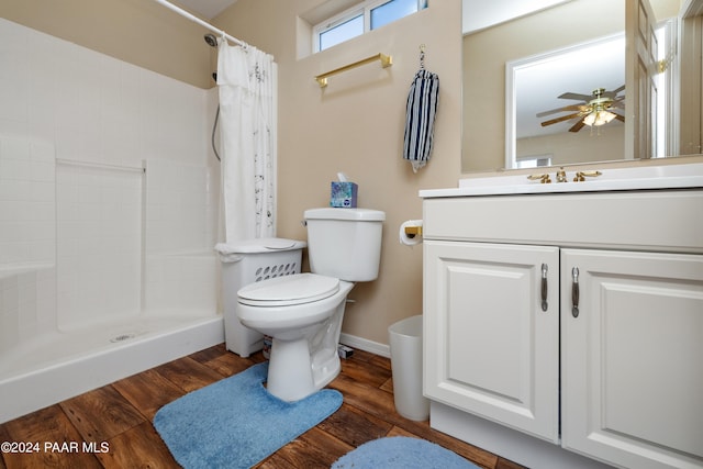 15015 E White Dr, Dewey-Humboldt, AZ 86327 - bathroom with toilet, vanity, a tile shower, ceiling fan, and wood finished floors