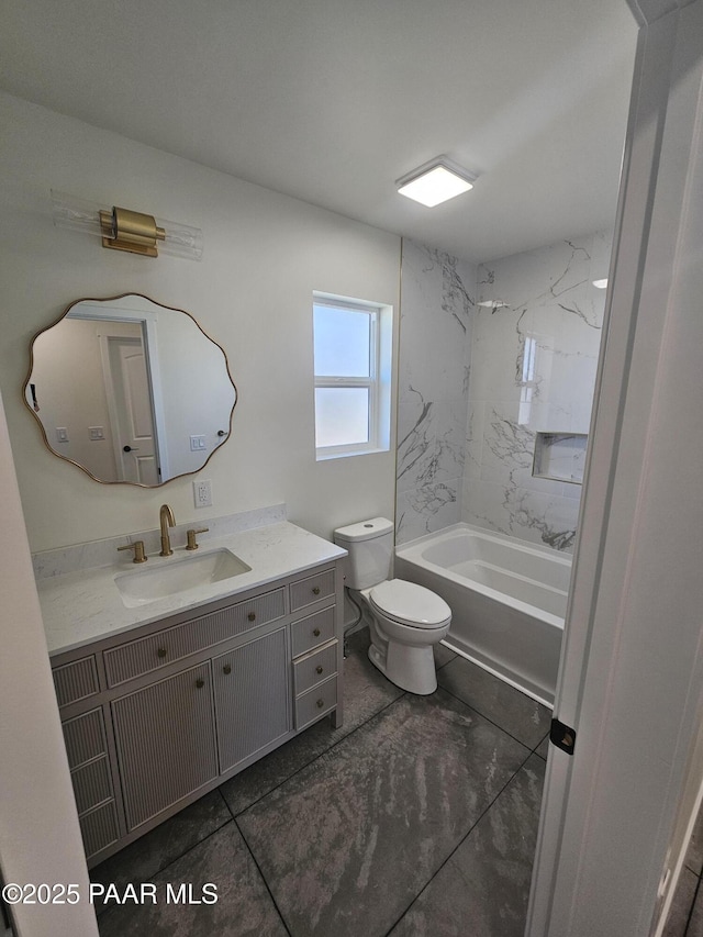 full bathroom featuring vanity, toilet, and tiled shower / bath