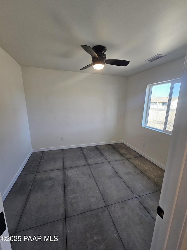 spare room with ceiling fan