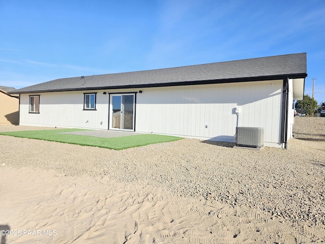 rear view of house featuring central air condition unit and a patio area